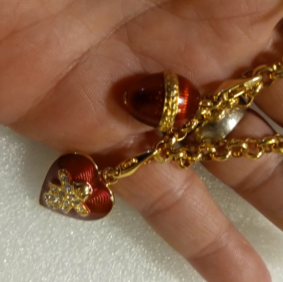 Faberge egg charm bracelet on a gold tone rolo chain. - Picture 2 of 16